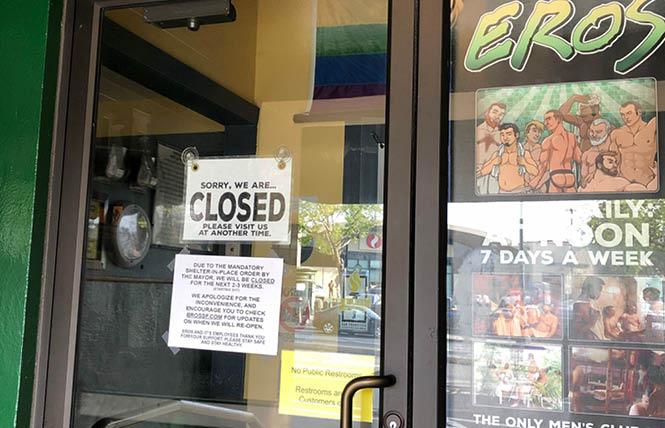 A sign on the door of Eros in San Francisco announced the sex club is closed due to coronavirus concerns. Photo: John Ferrannini