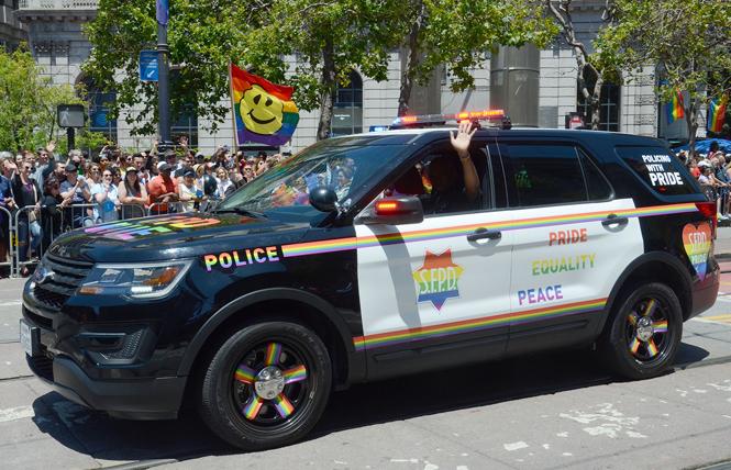 The San Francisco Police Department's rainbow-decorated patrol car made an appearance in the 2019 San Francisco LGBT Pride parade. Photo: Rick Gerharter