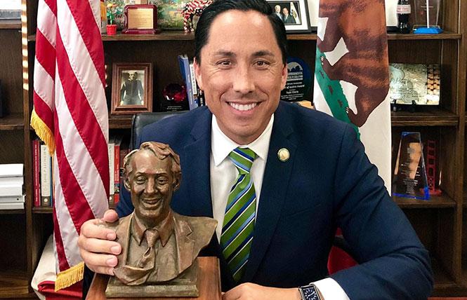 San Diego Mayor Todd Gloria shares an award he received, which is a small bust of Harvey Milk. Photo: Courtesy Nicole Murray Ramirez