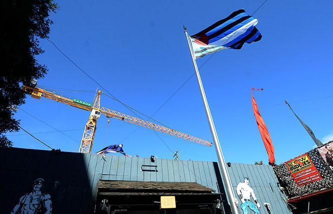 The leather pride flag flew outside the Eagle bar in 2018 as construction continued on a mixed-use development that paid for a leather-themed public plaza nearby. Photo: Rick Gerharter