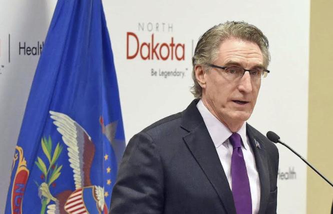 North Dakota Governor Doug Burgum signed an anti-LGBTQ bill into law Monday, April 19, which triggers the state being added to California's no-fly list. Photo: Courtesy AP