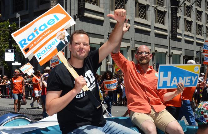 Then-Supervisor candidate Matt Haney, left, rode in the 2018 San Francisco Pride parade with then-Supervisor-elect Rafael Mandelman. Photo: Rick Gerharter