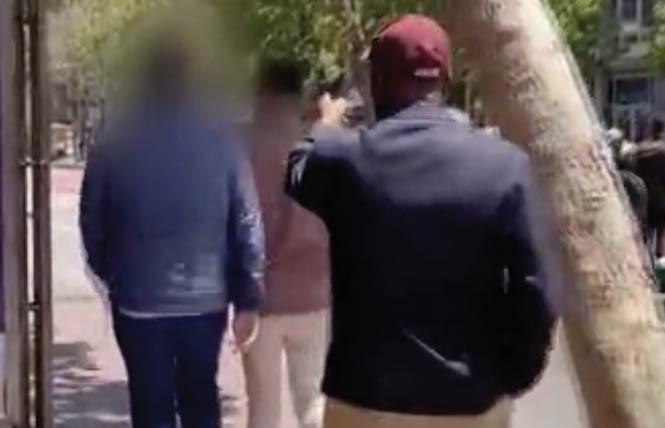 In this scene from a viral video, a man pointed at a gay biracial couple as he reportedly went on a racist rant against the men. Photo: Courtesy KTVU