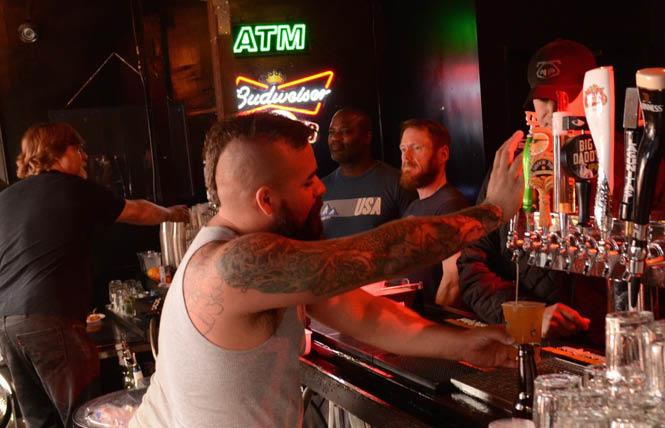 A bartender pours a drink at a beer bust at the Eagle bar in 2015. Photo: Steven Underhill