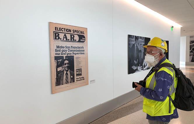 Bay Area Reporter photographer Rick Gerharter looked at an old front page of the LGBTQ newspaper at the new Harvey Milk installation in Harvey Milk Terminal 1 at San Francisco International Airport. Photo: Matthew S. Bajko