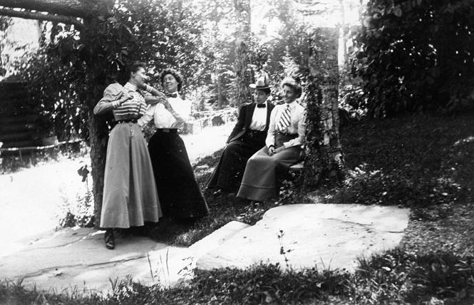 Gertrude Tate, second from left wearing white shirt and bow tie, and Alice Austen, third from left, seated, wearing white shirt and bow tie, enjoyed a trip to the Catskills in 1899. Austen made the photo album for Tate. Photo: Courtesy Collection, Alice Austen House
