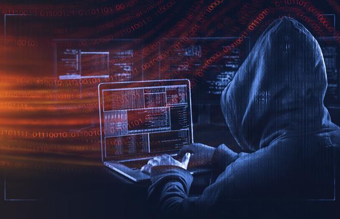 A photo illustration depicts a hacker breaking into computer systems. Photo: Courtesy AdobeStock/Oz