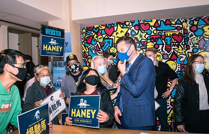 San Francisco Supervisor and Assembly candidate Matt Haney, third from right, spoke to constituents at his campaign office open house in the former Pottery Barn space at Market and Castro streets on Wednesday, November 10. Photo: Christopher Robledo