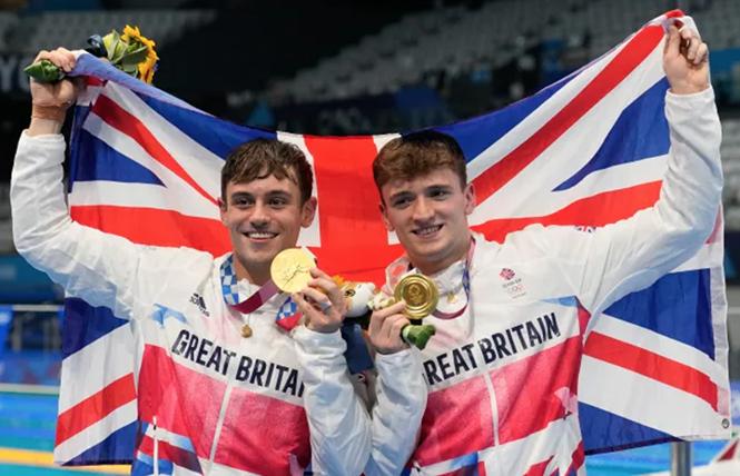 Gay diver Thomas Daley, left, and ally Matty Lee of Britain posed for a photo after winning gold medals during the men's synchronized 10-meter platform diving final at the Tokyo Aquatics Center at the Tokyo Olympics in Japan July 26. Photo: Dmitri Lovetsky/AP