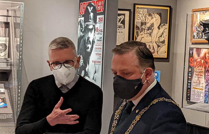 Gerard Koskovich, left, a queer historian and former board member of the GLBT Historical Society, guides Cork, Ireland Lord Mayor Colm Kelleher on a visit of the society's museum in the Castro March 11. Photo: Eric Burkett