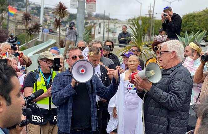 Cleve Jones, right, shown at a 2021 rally in the Castro, will be moving from his longtime home Sunday. Photo: John Ferrannini <br>