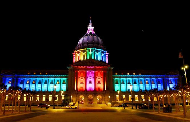 Wrangling is underway at San Francisco City Hall, seen lit in rainbow colors, over new boundaries for the city's supervisor districts. Photo: Steven Underhill 