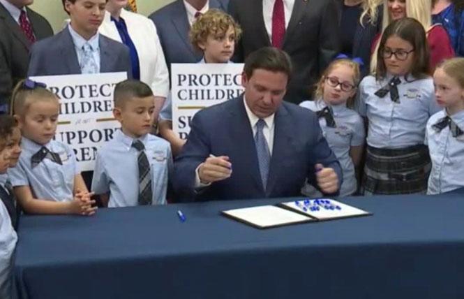 Governor Ron DeSantis signed the "Don't Say Gay" bill into law March 28 at a charter school that would be exempt from it. Photo: Courtesy WFTS