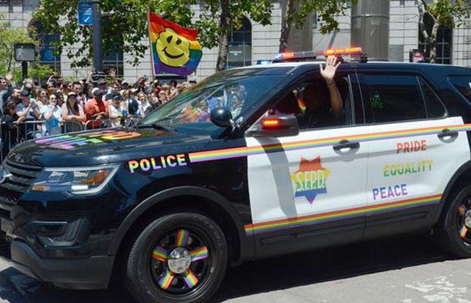 The San Francisco Police Department's rainbow-decorated patrol car made an appearance in the 2019 San Francisco LGBT Pride parade. Photo: Rick Gerharter  