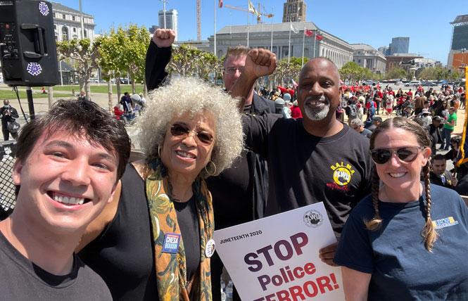Joe Thompson, left, met up with out professor and activist Angela Davis, Trent Willis, president of International Longshore and Warehouse Union Local 10, and Kelly Kick, a member of United Food and Commercial Workers Union Local 5, at the May Day rally in San Francisco. Photo: Courtesy Joe Thompson