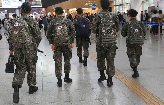 South Korean soldiers walk through an airport. Photo: AP
