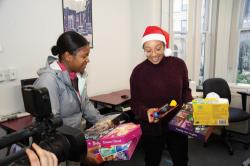 Alleah Smith-Jackson, (left) South End NSC client, chooses toys for her children with the help of Amber Dickerson, Operations Manager, ABCD South End NSC. This year the ABCD Toy Drive gathered close to 7,000 toys for children in low-income families in all of Boston's neighborhoods and the Mystic Valley area. Many parents work two and three jobs but struggle to pay for rent, food and utilities and there is not enough left for holiday toys — so ABCD and other toy drives fill that gap and make a difference for families in need.