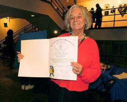 Marleen Neenhuis displays one of her awards