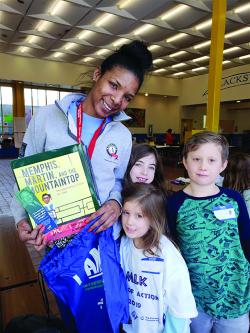 SSYP staff person Latasha Scott with new friends at the 2019 MLK Day of Action at the Blackstone Elementary School