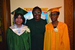 Principal Nampeera Lugira with salutatorian David Espinosa and  valedictorian Czarina Preval