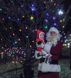 Santa with one year old M.J. Skelly. Photo by Ethan S. Gould.