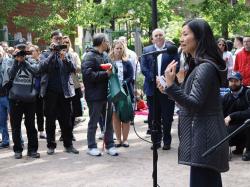 Mayor Michelle Wu addresses a packed crowd in Hayes Park during the May 25 Neighborhood Coffee Hour hosted by the Boston Parks and Recreation Department in partnership with Dunkin' and Star Market. Photo by Jon Seamans.