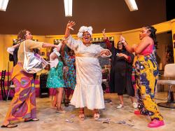 MaConnia Chesser (center) and the cast of Jaja's African Hair Braiding. Photo by Nile Scott Studios.