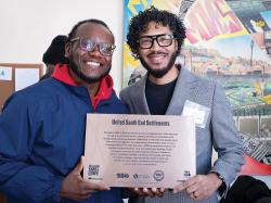 USES President and CEO Jerrell Cox (left) and Paris Jeffres (right) after the unveiling. Photo by Pete Johannsen.