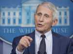 Fauci Says Omicron Variant is `Just Raging Around the World'